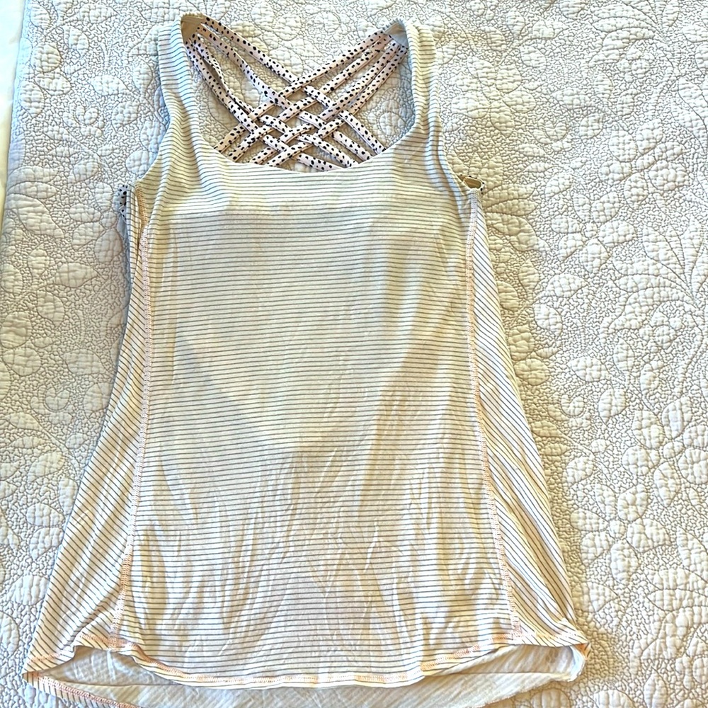 lululemon light support yoga tank with built in bra. Size 8, light pink